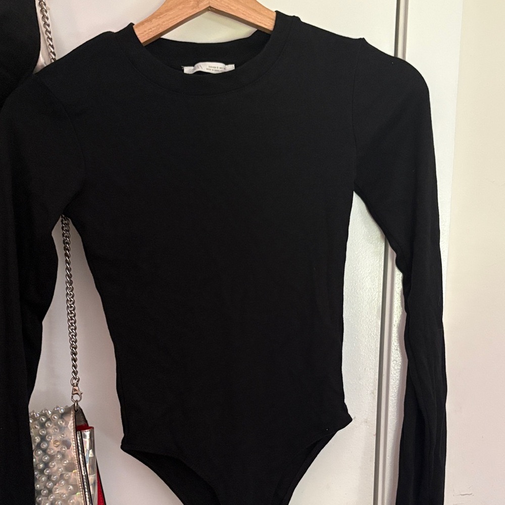 Woman’s Black Long-Sleeve One-Piece Bodysuit